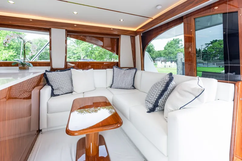 Slide: The Image of Luxurious interior of 2022 Viking 48 Convertible yacht with elegant seating and wooden accents. - 35