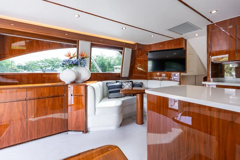 Slide: The Image of Luxurious interior of 2022 Viking 48 Convertible yacht with elegant wood finishes and modern decor. - 36