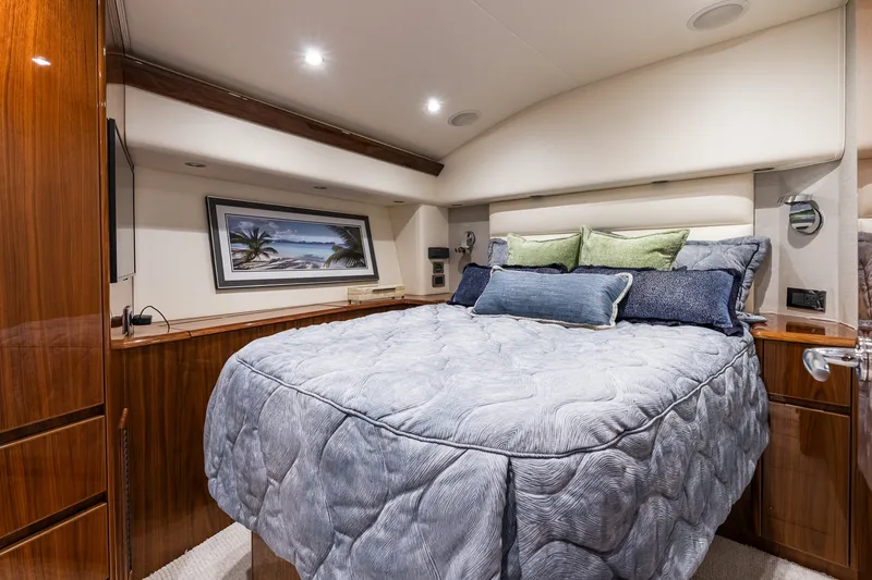 Slide: The Image of Luxurious bedroom interior of 2022 Viking 48 Convertible yacht with elegant bedding and decor. - 44
