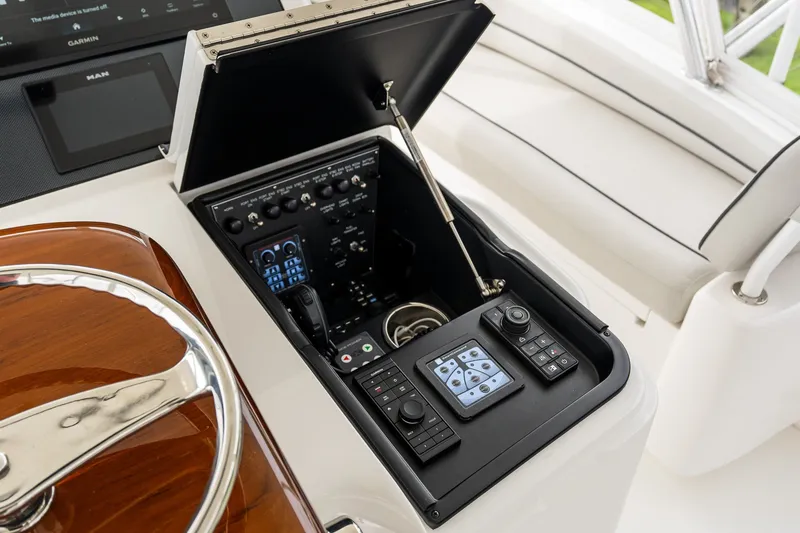 Slide: The Image of Control panel of 2022 Viking 48 Convertible yacht with advanced navigation systems. - 24