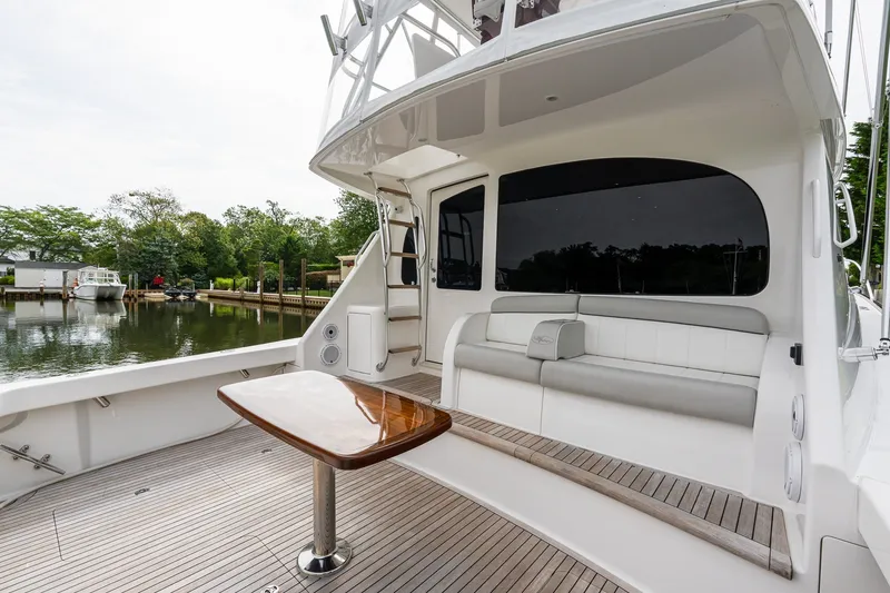 Slide: The Image of 2022 Viking 48 Convertible yacht with sleek deck and comfortable seating. - 6