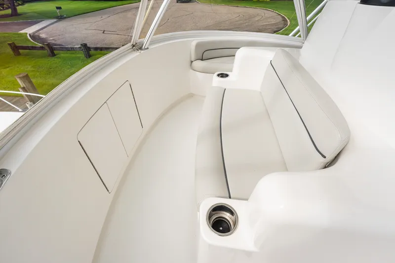 Slide: The Image of Luxurious seating area on 2022 Viking 48 Convertible yacht, featuring sleek white upholstery. - 17