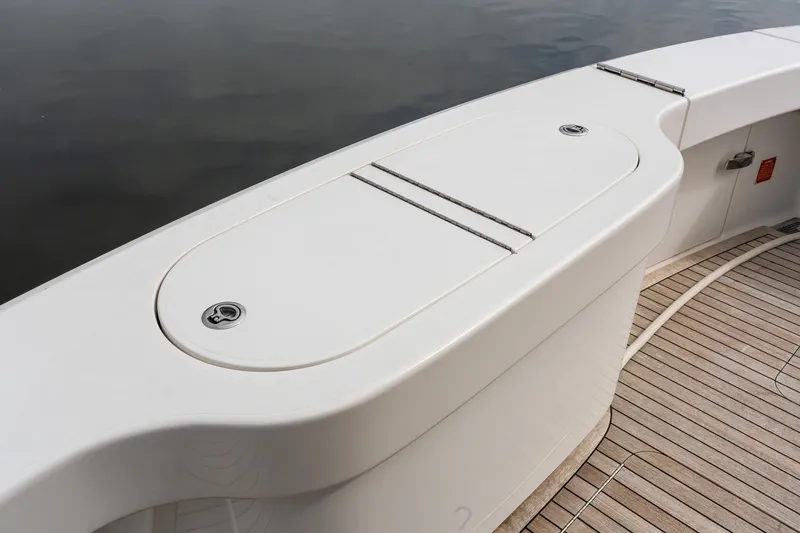 Slide: The Image of Deck view of 2022 Viking 48 Convertible yacht with sleek white finish. - 8