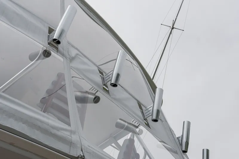 Slide: The Image of Close-up of 2022 Viking 48 Convertible yacht's sleek metal fixtures and clear canopy. - 29