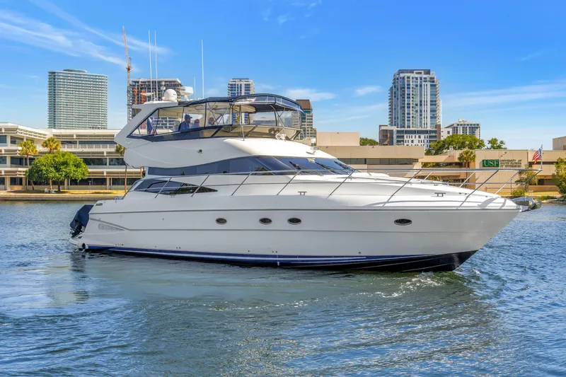 The Image of 2001 Neptunus 56 Flybridge yacht cruising in urban waterfront setting. - 0