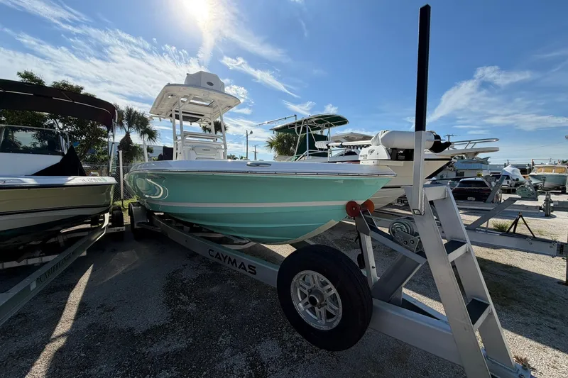 Slide: The Image of 2021 Caymas 28 HB boat on trailer under sunny sky at marina. - 37