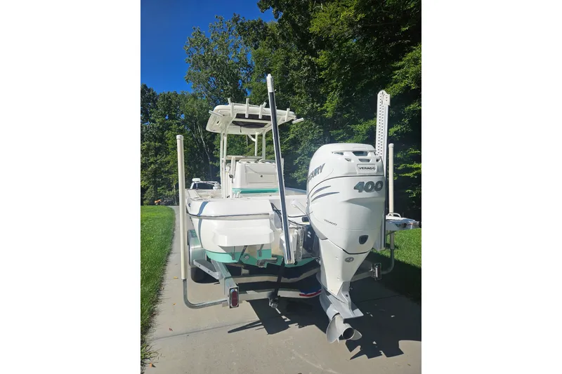 Slide: The Image of 2021 Caymas 28 HB boat with Mercury 400 Verado engine on a driveway. - 24