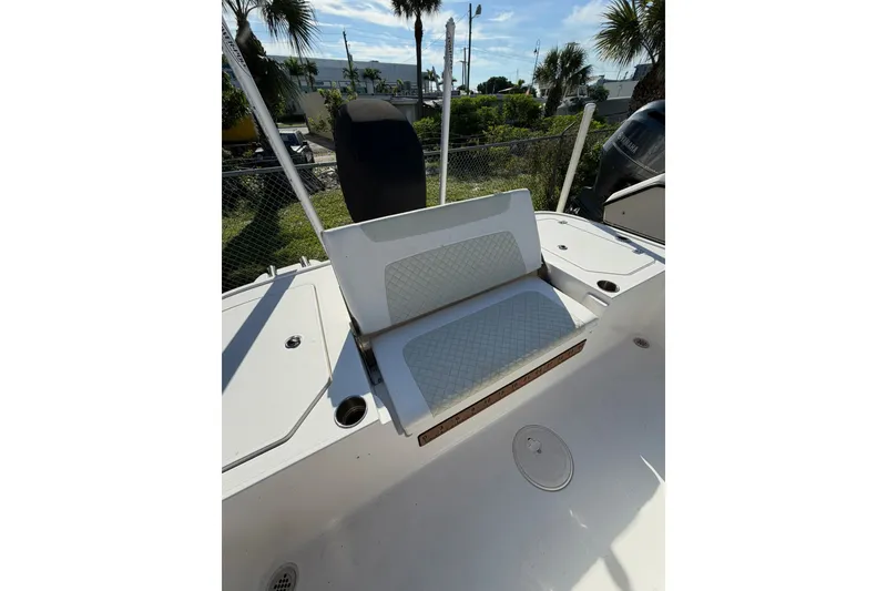 Slide: The Image of 2021 Caymas 28 HB boat interior with cushioned seating and storage compartments. - 21