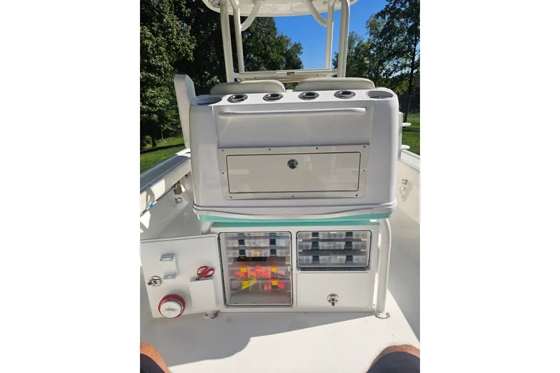 Slide: The Image of 2021 Caymas 28 HB boat interior with storage compartments and fishing gear. - 17