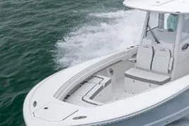 The Image of 2026 Regulator 35 boat cruising on open water, showcasing sleek design and spacious seating. - 2