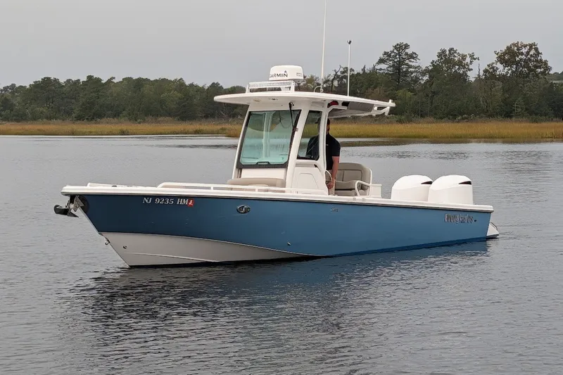 The Image of 2019 Everglades 273 Center Console boat on calm water, side view. - 0