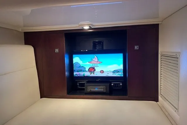 Slide: The Image of Interior of 2015 Chaparral 310 Signature yacht with built-in TV entertainment system. - 20