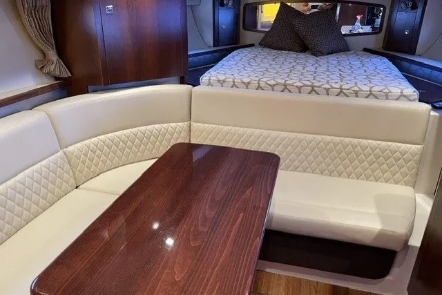Slide: The Image of Luxurious interior of 2015 Chaparral 310 Signature yacht with seating and bed. - 24