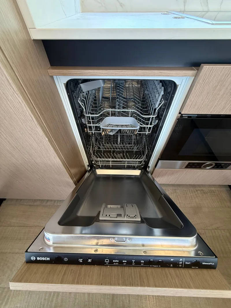 Slide: The Image of Open Bosch dishwasher in a modern boat kitchen. - 41