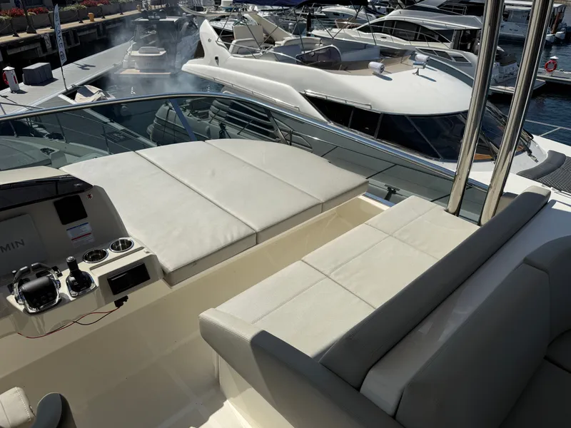 Slide: The Image of The image shows the deck of a 2022 Absolute 62 Fly with luxurious seating. - 30