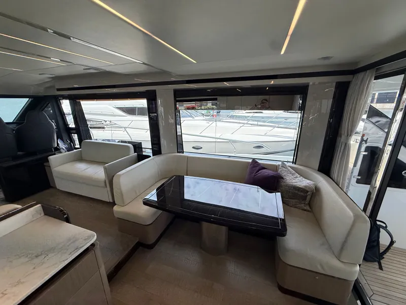 Slide: The Image of Interior of the 2022 Absolute 62 Fly with elegant seating area and large windows. - 39