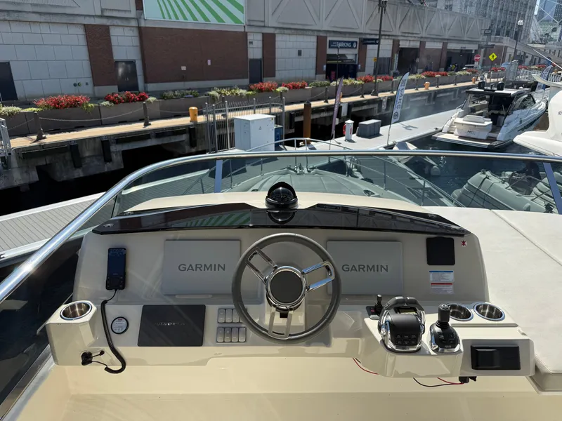 Slide: The Image of The image shows the helm of a 2022 Absolute 62 Fly with Garmin equipment. - 33
