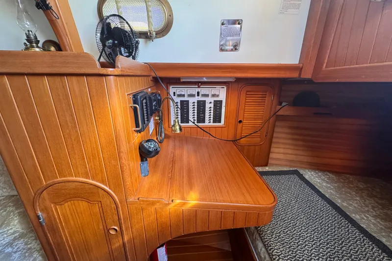 Slide: The Image of Wooden interior of 1986 Tashing Tashiba 31 sailboat with control panel and fan. - 17