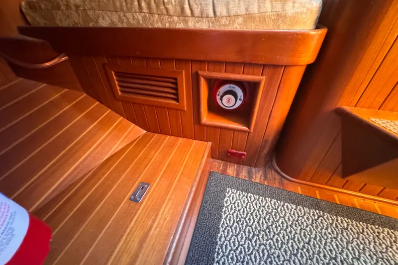 Slide: The Image of Wooden interior of 1986 Tashing Tashiba 31 boat with control panel and carpet. - 27