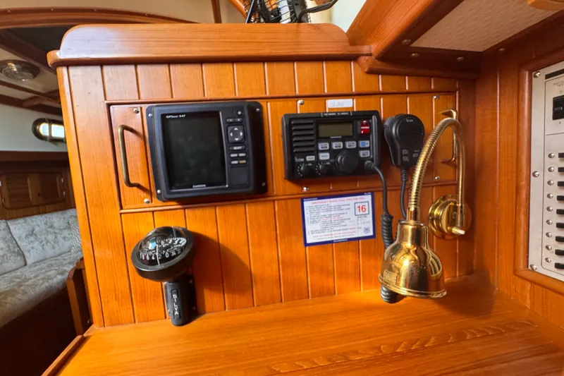 Slide: The Image of Wooden interior of 1986 Tashing Tashiba 31 yacht with navigation equipment and brass lamp. - 29