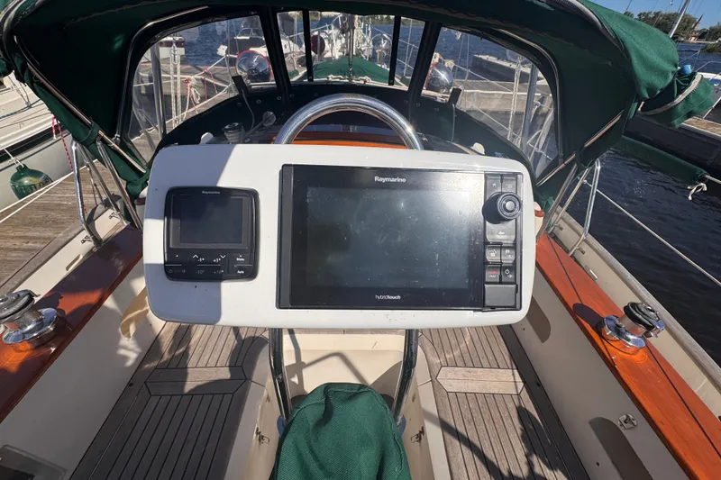 Slide: The Image of Cockpit of 1986 Tashing Tashiba 31 sailboat with navigation equipment and wooden deck. - 37