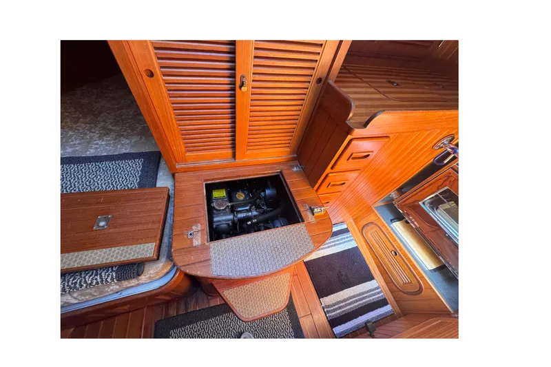 Slide: The Image of Engine compartment of 1986 Tashing Tashiba 31 sailboat with wooden interior. - 31