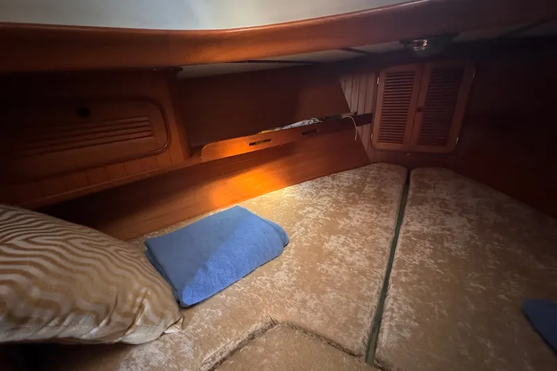 Slide: The Image of Cozy cabin interior of 1986 Tashing Tashiba 31 sailboat with wooden finish. - 24