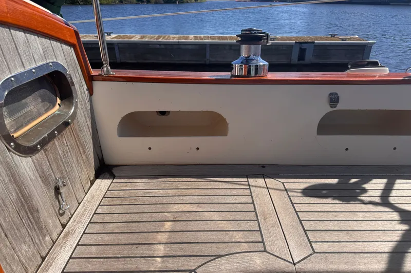 Slide: The Image of Cockpit of 1986 Tashing Tashiba 31 sailboat with wooden deck and winch. - 33