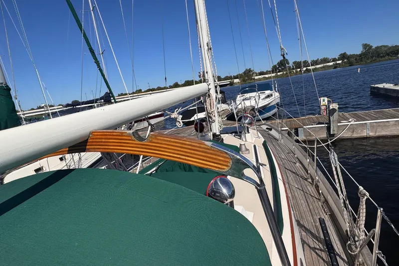 Slide: The Image of Sailboat Tashing Tashiba 31, 1986 model, docked at a marina on a sunny day. - 10