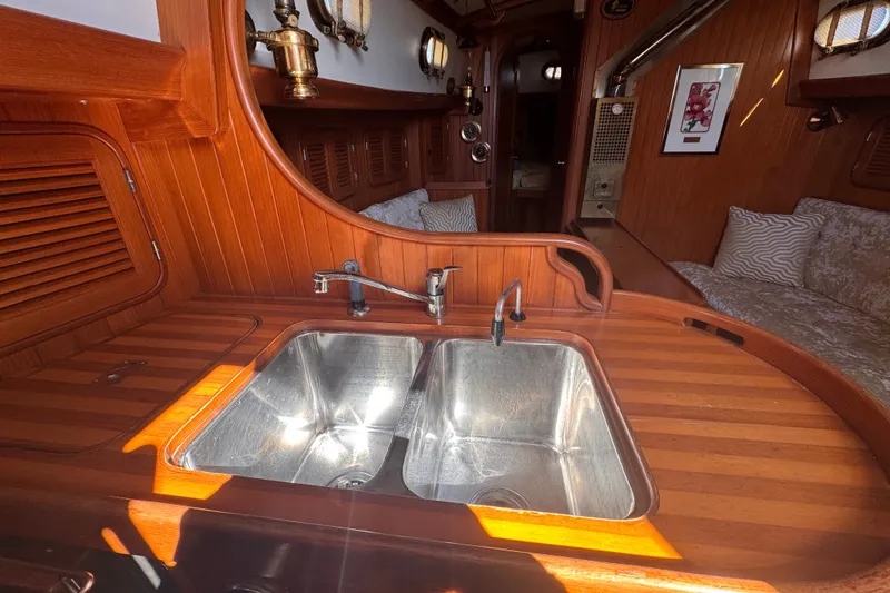Slide: The Image of Wooden interior of 1986 Tashing Tashiba 31 yacht with dual stainless steel sink. - 16