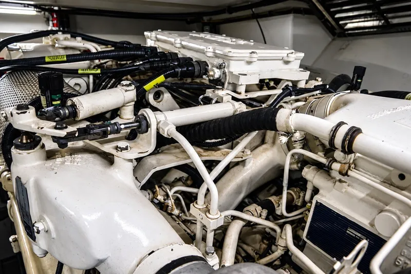 Slide: The Image of Engine room of a 2004 Azimut 62 yacht, showcasing complex machinery and components. - 36