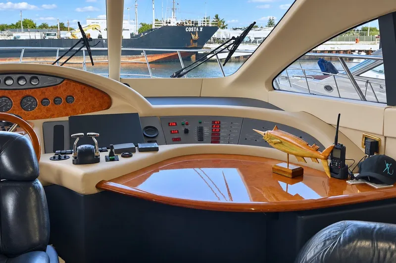 Slide: The Image of Cockpit of a 2004 Azimut 62 yacht with control panel and nautical decor. - 24