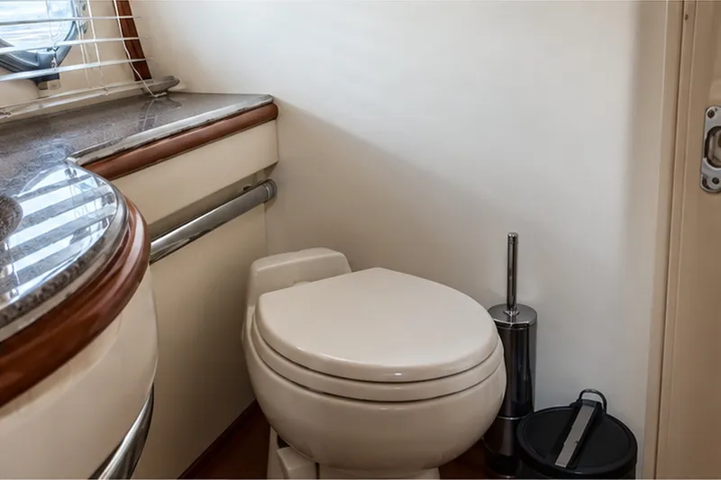 Slide: The Image of Luxury yacht Azimut 62 bathroom interior, featuring a modern toilet and elegant countertop. - 13