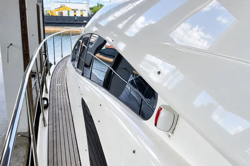 Slide: The Image of 2004 Azimut 62 yacht side view with sleek design and polished deck. - 41