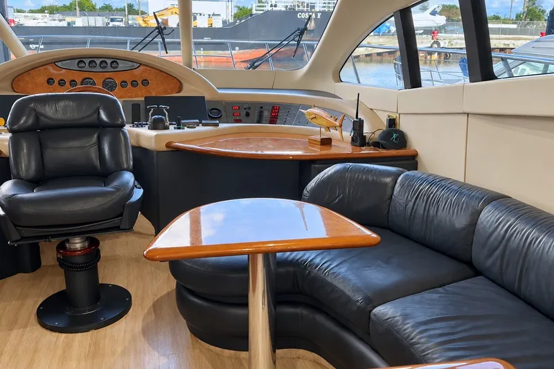 Slide: The Image of Luxurious interior of a 2004 Azimut 62 yacht with leather seating and wooden accents. - 26