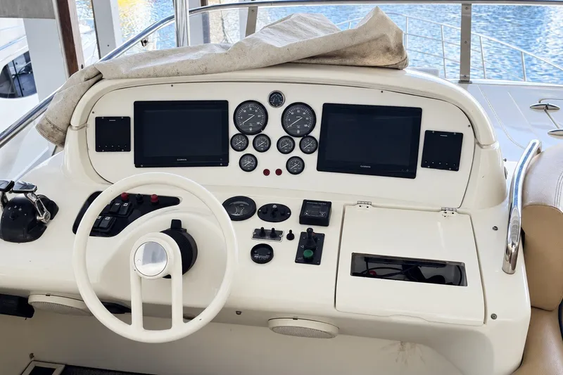 Slide: The Image of Cockpit of 2004 Azimut 62 yacht with steering wheel and navigation instruments. - 22