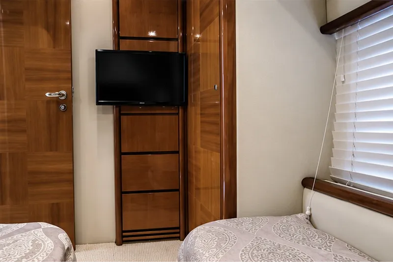 Slide: The Image of Luxurious cabin interior of 2004 Azimut 62 yacht with TV and elegant wood finishes. - 17