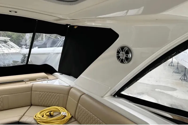 Slide: The Image of Interior of 2024 Sea Ray SLX 310 boat with seating and speaker. - 39
