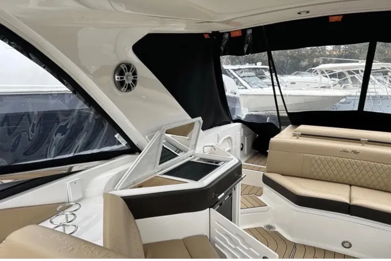 Slide: The Image of 2024 Sea Ray SLX 310 interior with luxurious seating and modern amenities. - 38