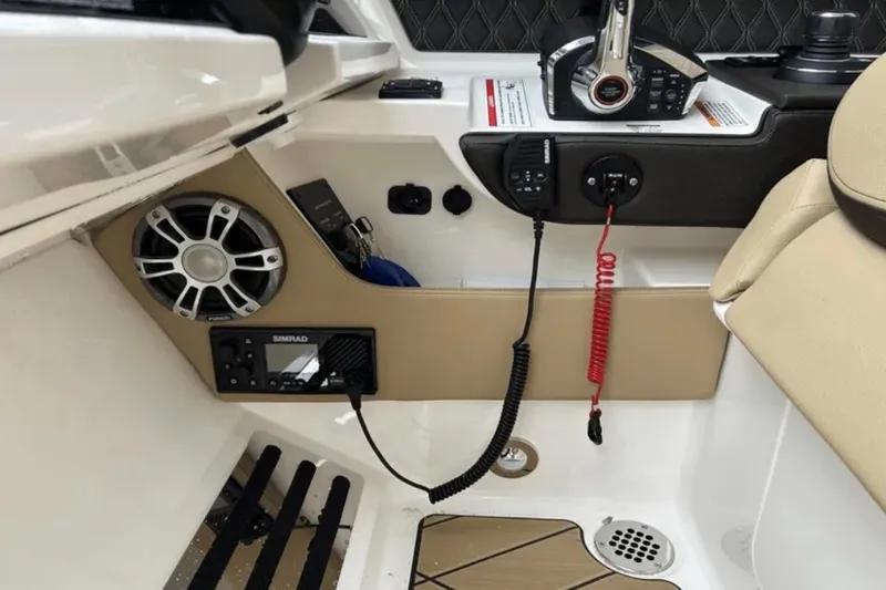 Slide: The Image of 2024 Sea Ray SLX 310 boat interior with speaker and control panel. - 41