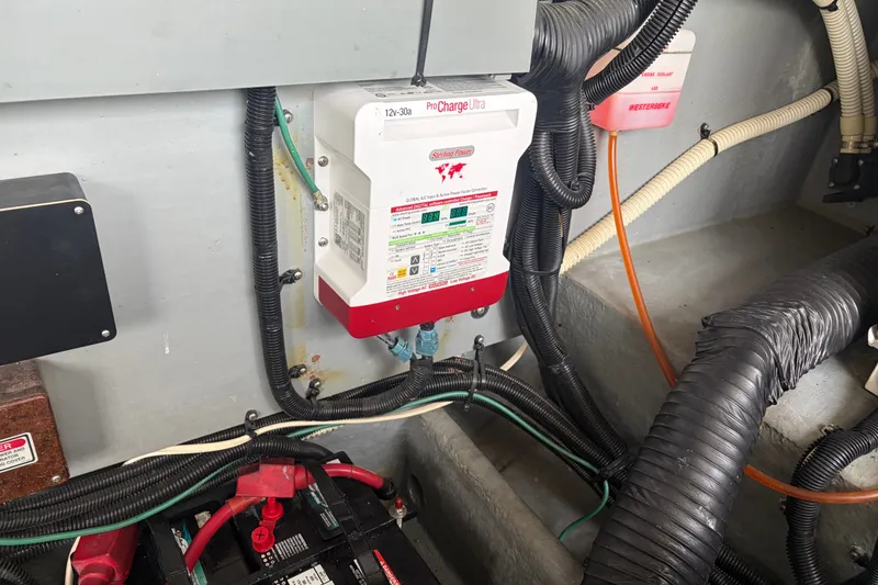 Slide: The Image of Engine compartment of a 1999 Sea Ray 370 Express Cruiser with battery and wiring. - 39