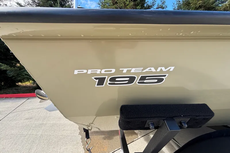 Slide: The Image of 2026 Tracker Pro Team 195 boat side view with logo. - 42