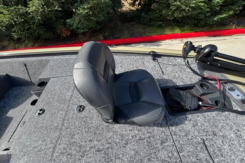 Slide: The Image of 2026 Tracker Pro Team 195 boat interior with gray seating and control panel. - 25