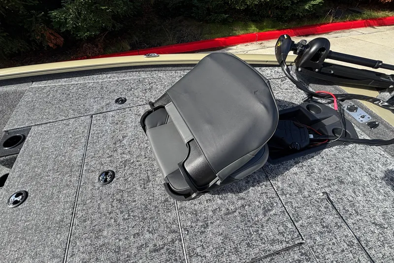 Slide: The Image of 2026 Tracker Pro Team 195 boat deck with seat and motor controls. - 24
