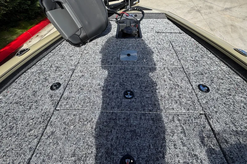 Slide: The Image of 2026 Tracker Pro Team 195 boat deck with gray carpet and seating. - 23