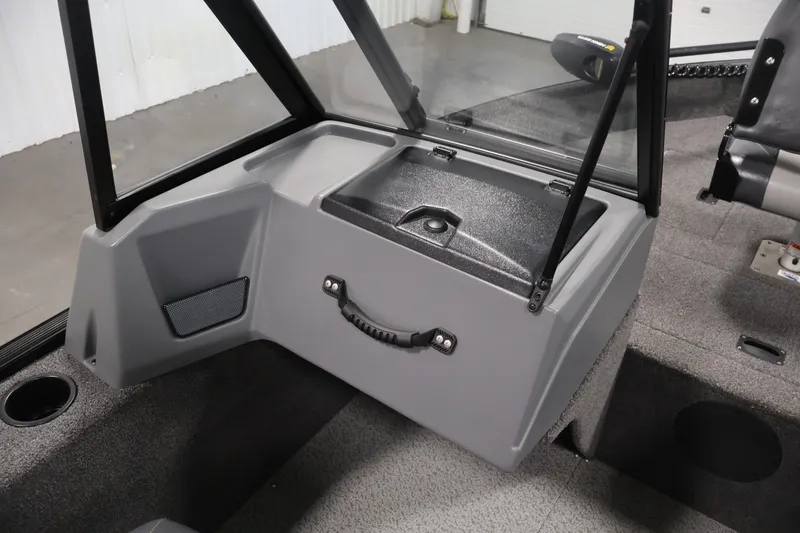 Slide: The Image of 2022 Lowe Fishing Machine 1625WT interior with storage compartment and seating. - 27