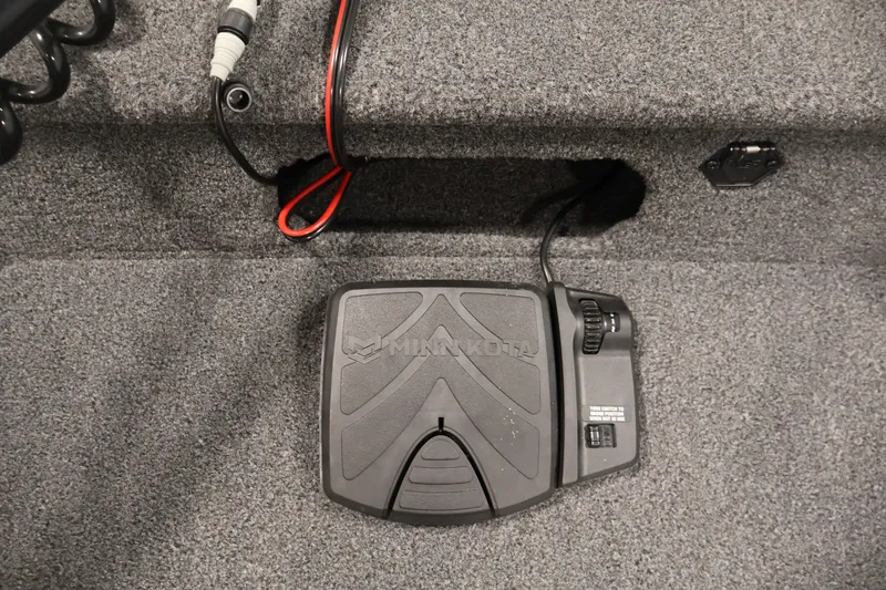 Slide: The Image of Foot pedal control on 2022 Lowe Fishing Machine 1625WT boat, featuring Minn Kota branding. - 14