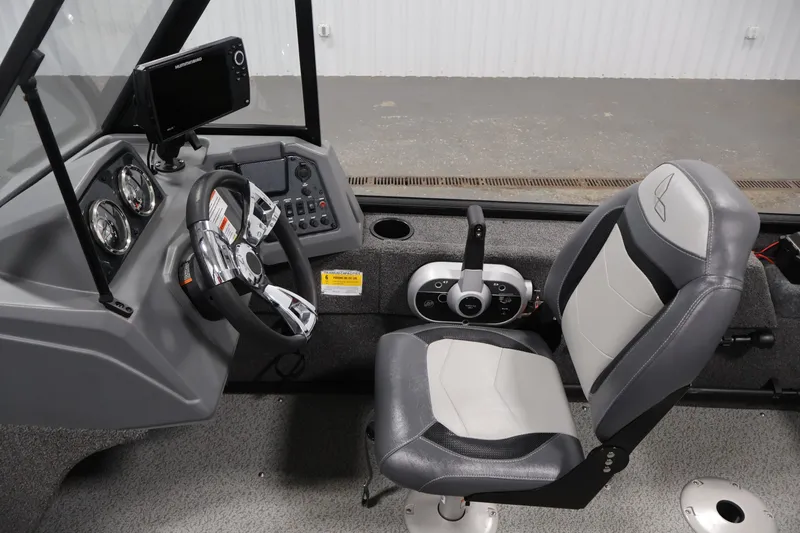 Slide: The Image of 2022 Lowe Fishing Machine 1625WT interior with steering wheel and control panel. - 19