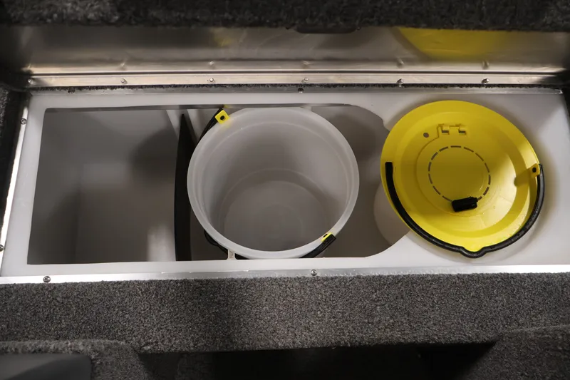 Slide: The Image of Storage compartment with buckets in a 2022 Lowe Fishing Machine 1625WT boat. - 18