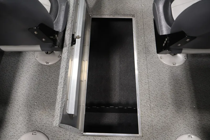 Slide: The Image of 2022 Lowe Fishing Machine 1625WT boat interior with open storage compartment. - 31